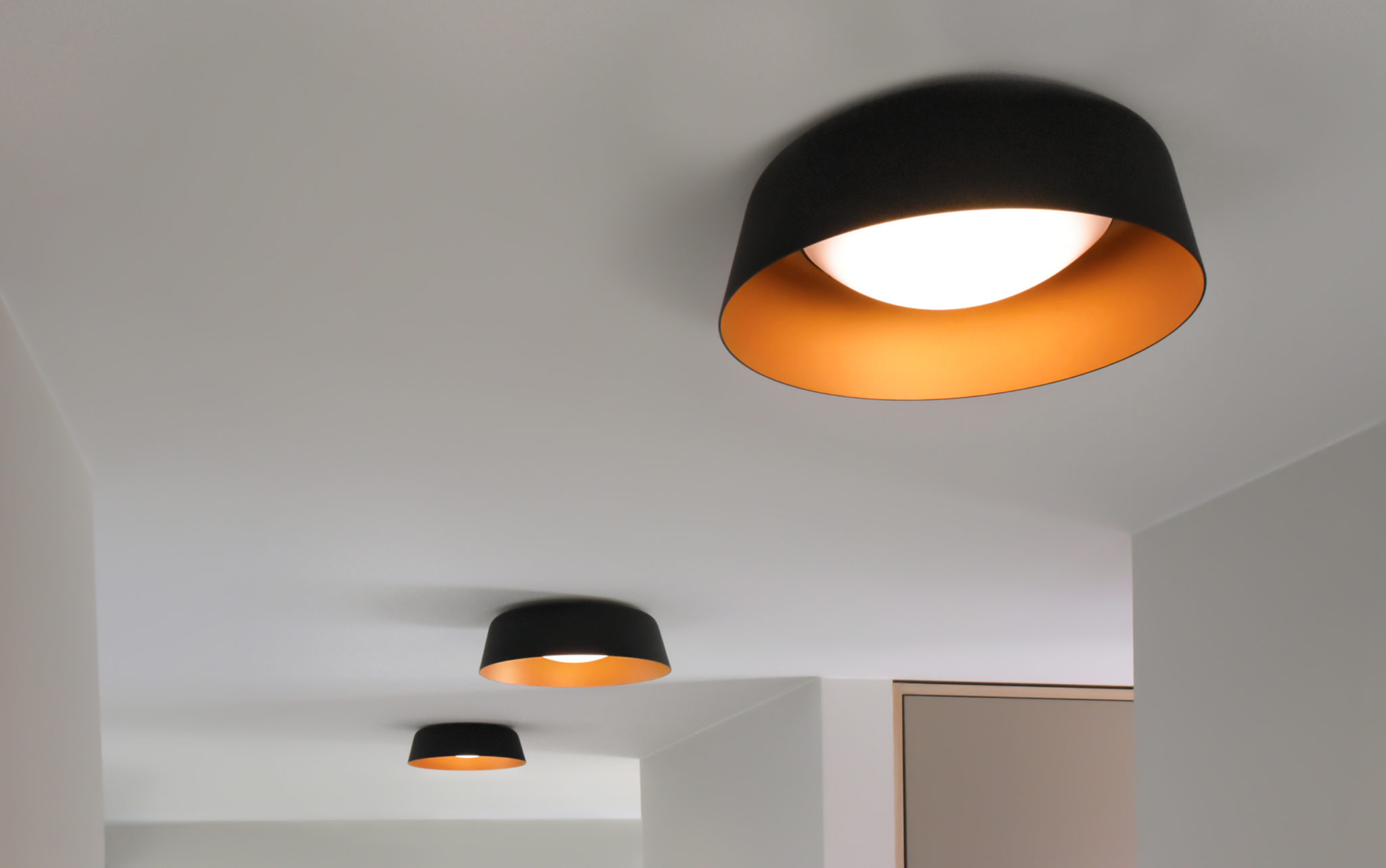 Three Bowl LED ceiling lamps in bi-colour in a modern entrance area.