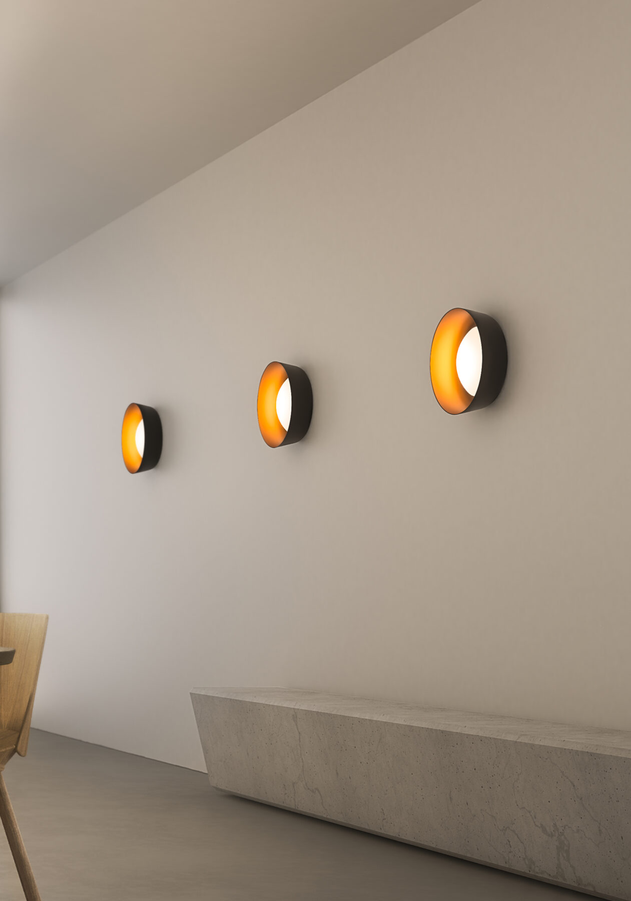BELS BOWL wall lights as a row on a wall.