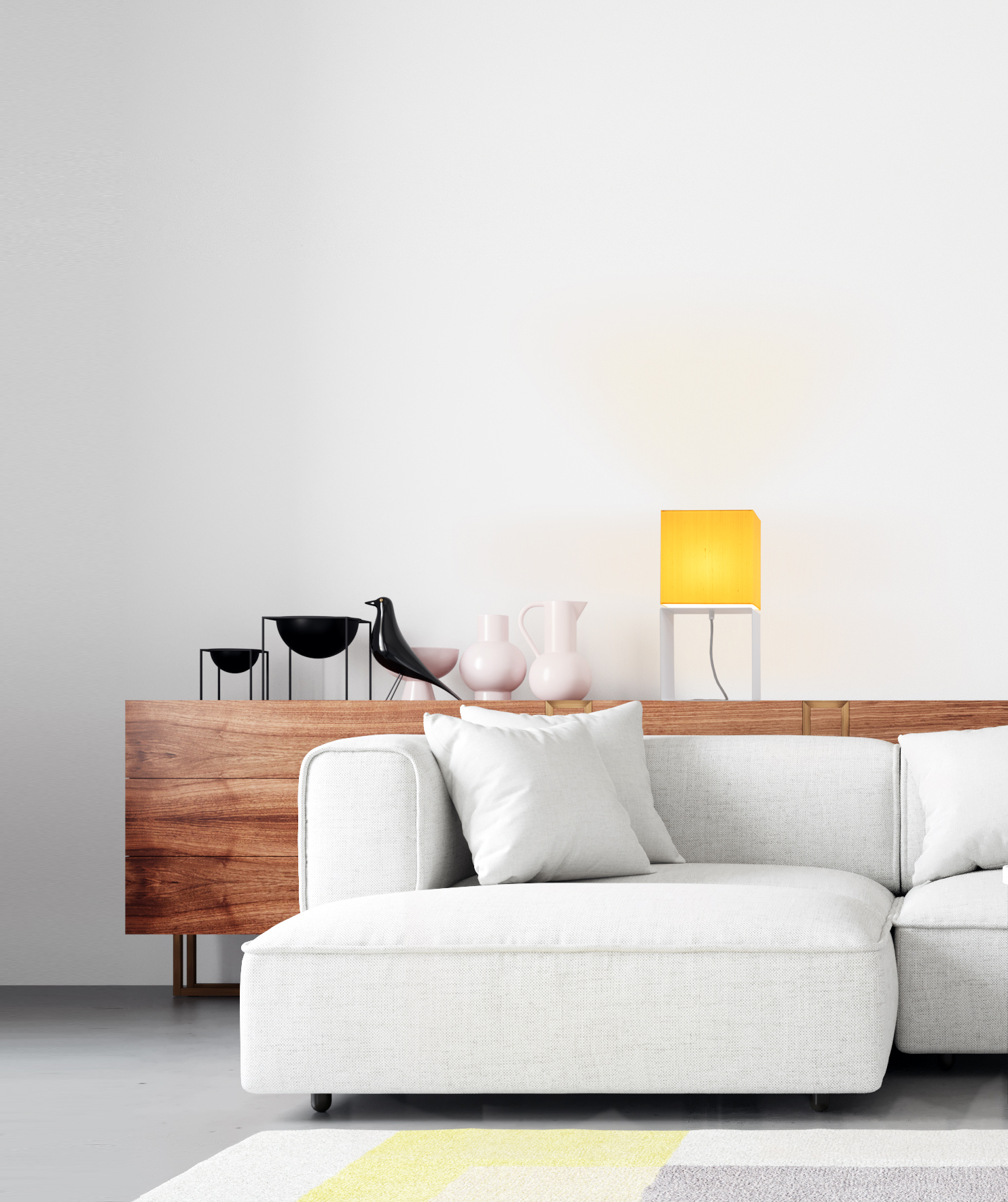 The Gate 27 table lamp with white base and yellow silk shade on a sideboard in a bright living room.