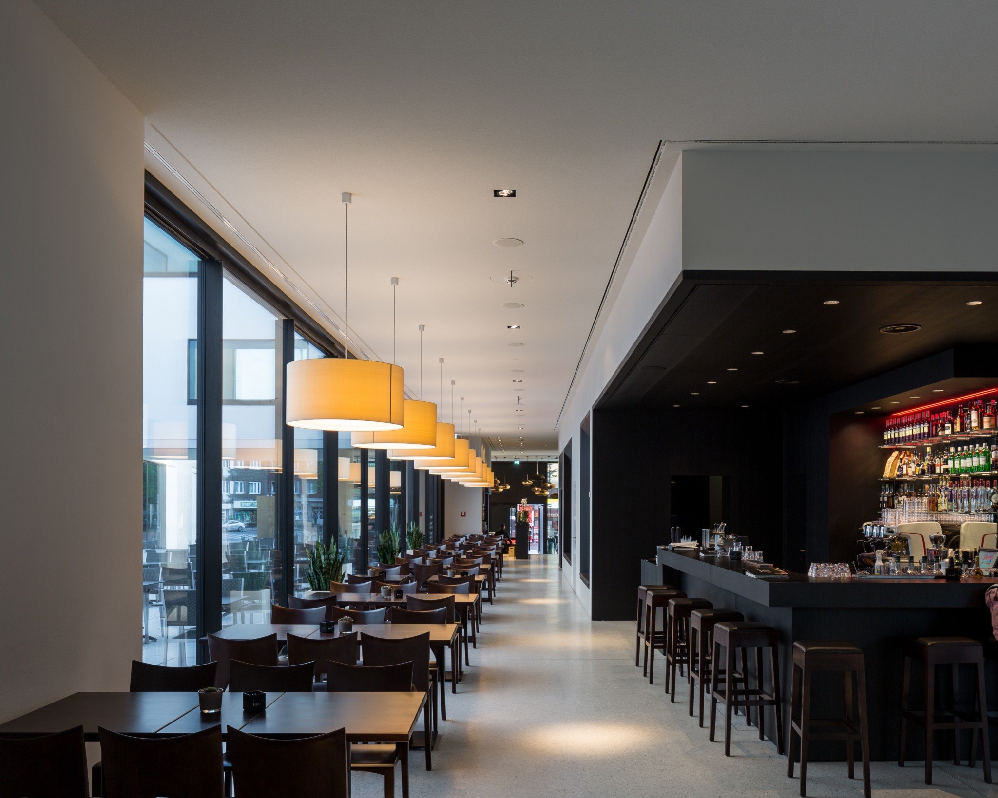 Several CYLS DRUM 76 pendant lights in the museum café of the LWL Museum