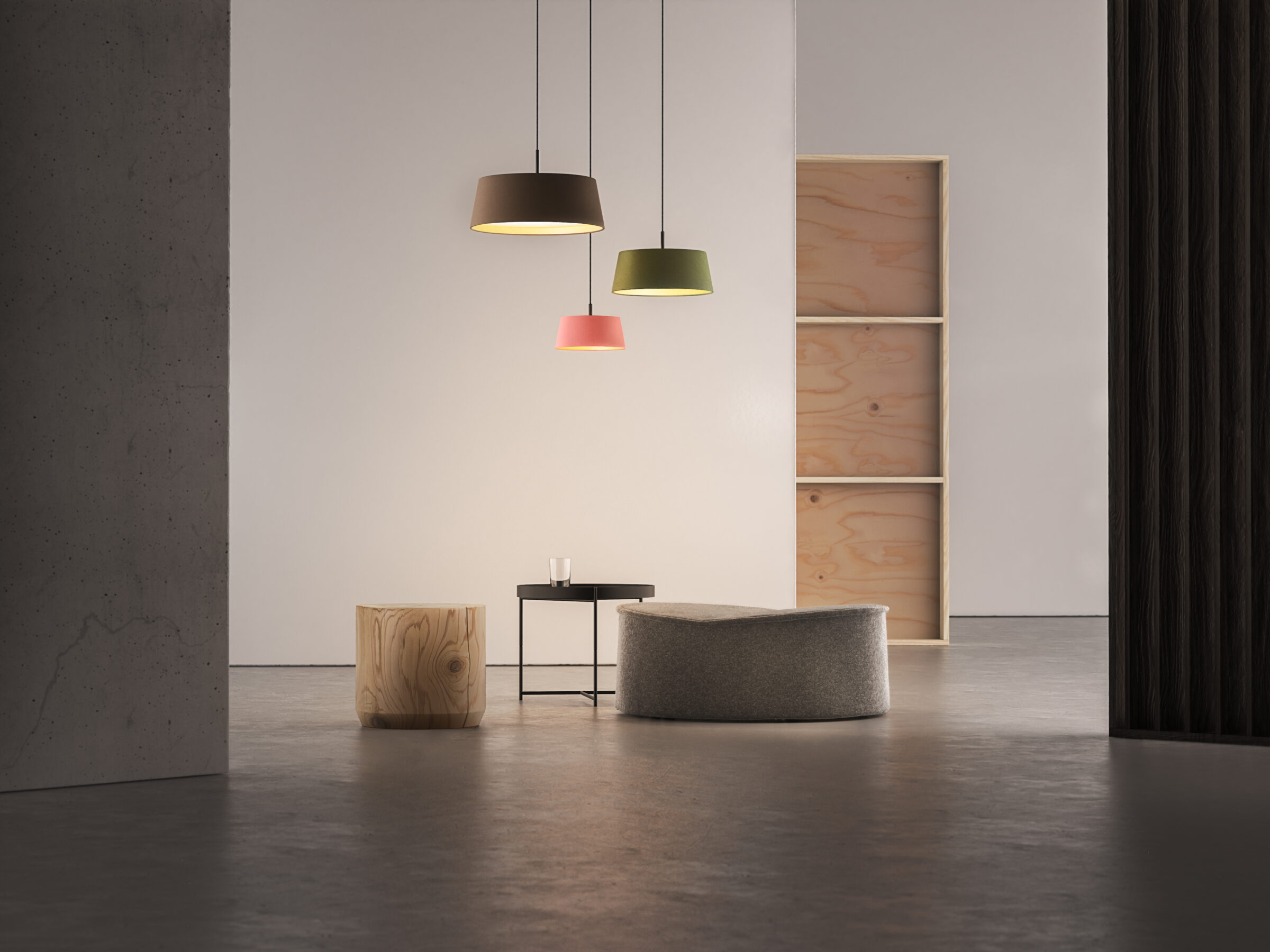 Three LEA P pendant lamps with textile shade combined to a modern seating group.