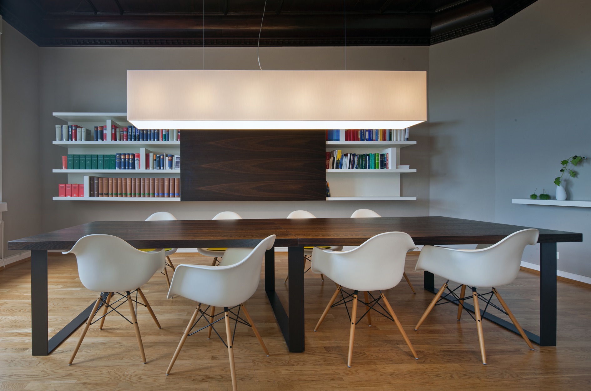 Long pendant lamp made of chintz in a meeting room.